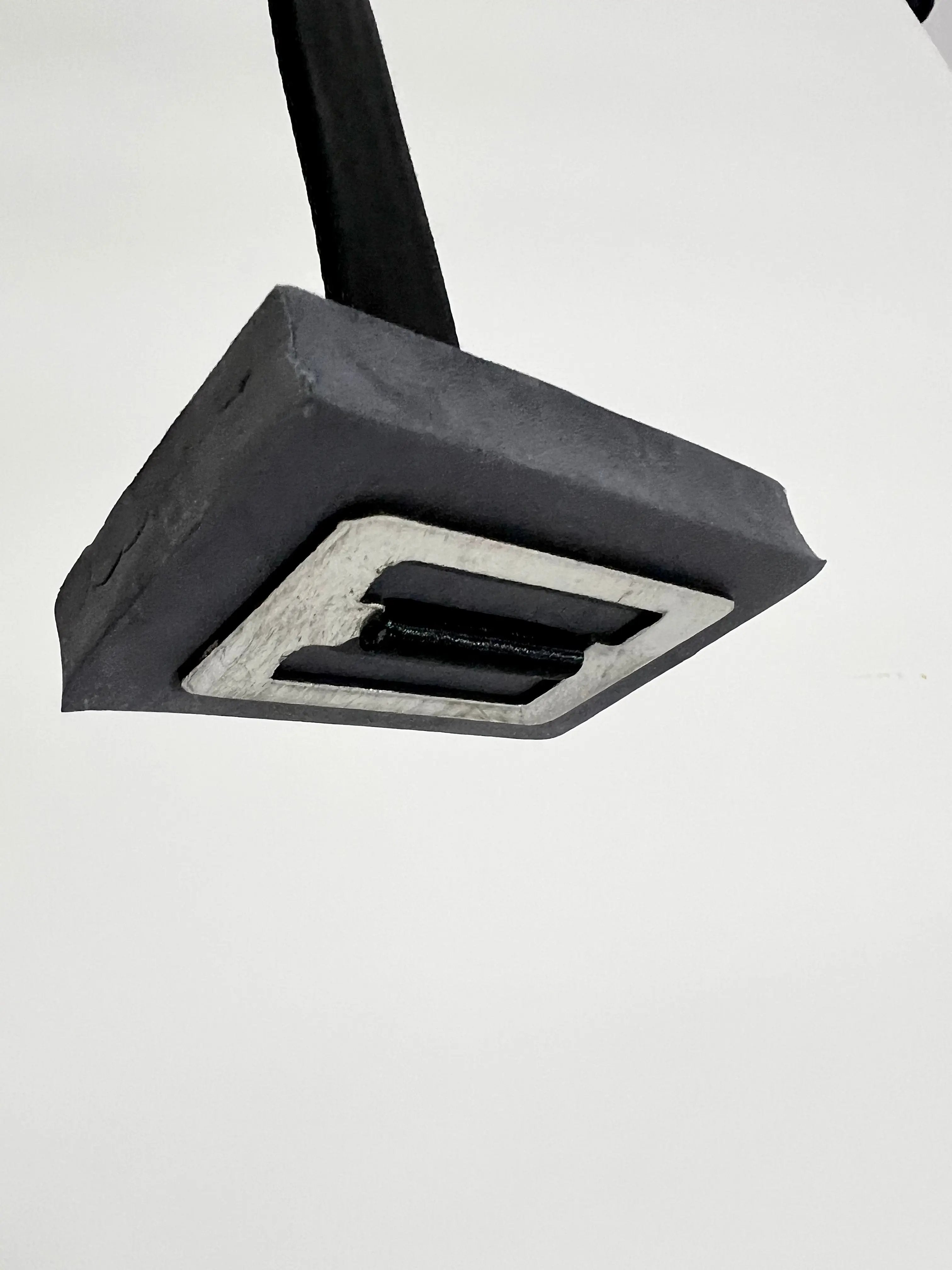 Black ceiling light fixture on a white background