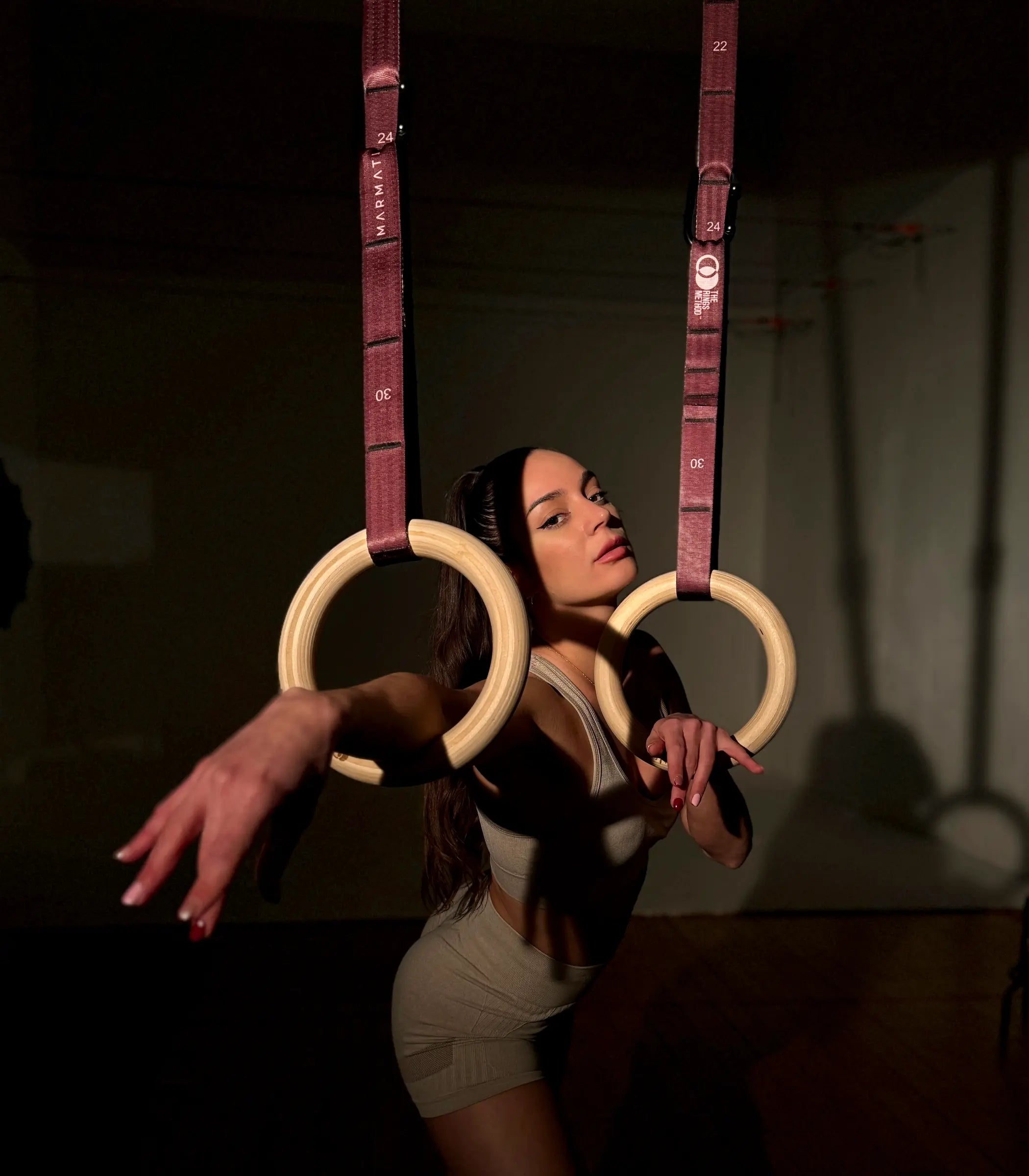 Airtime™ Gymnastic Rings set up in a home gym for strength training.