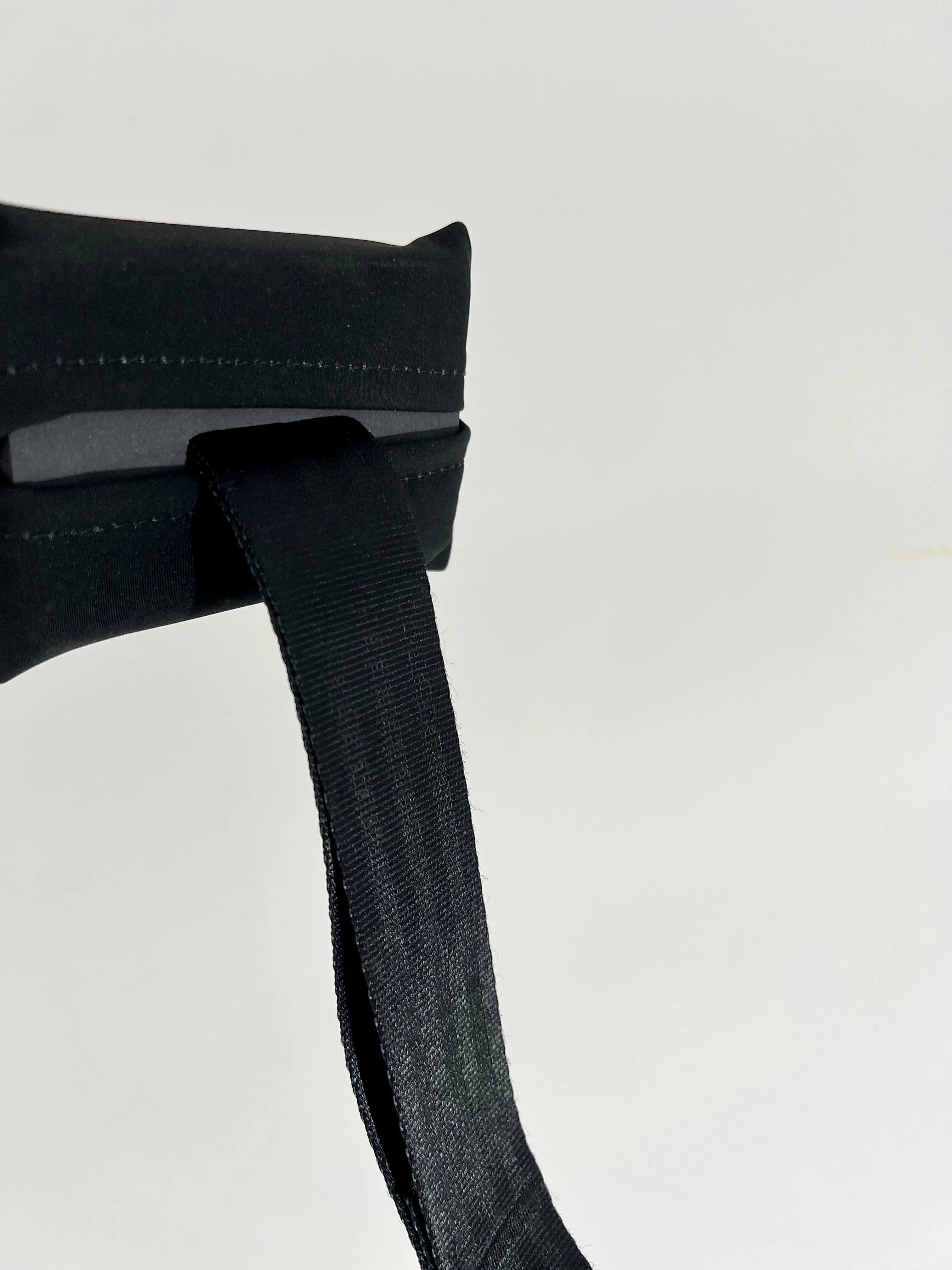 Black belt with a buckle on a light gray background