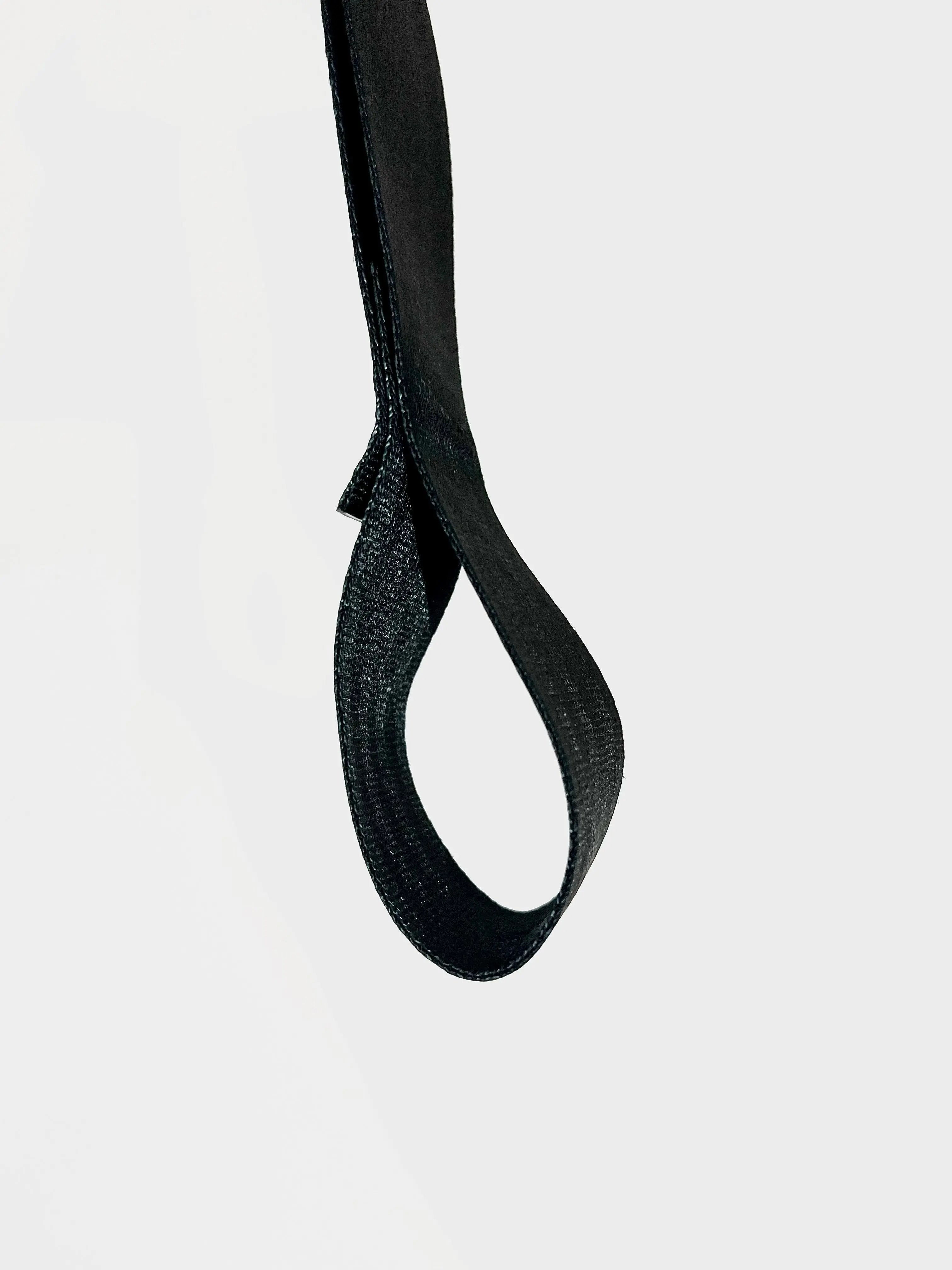 Black strap on a light gray background