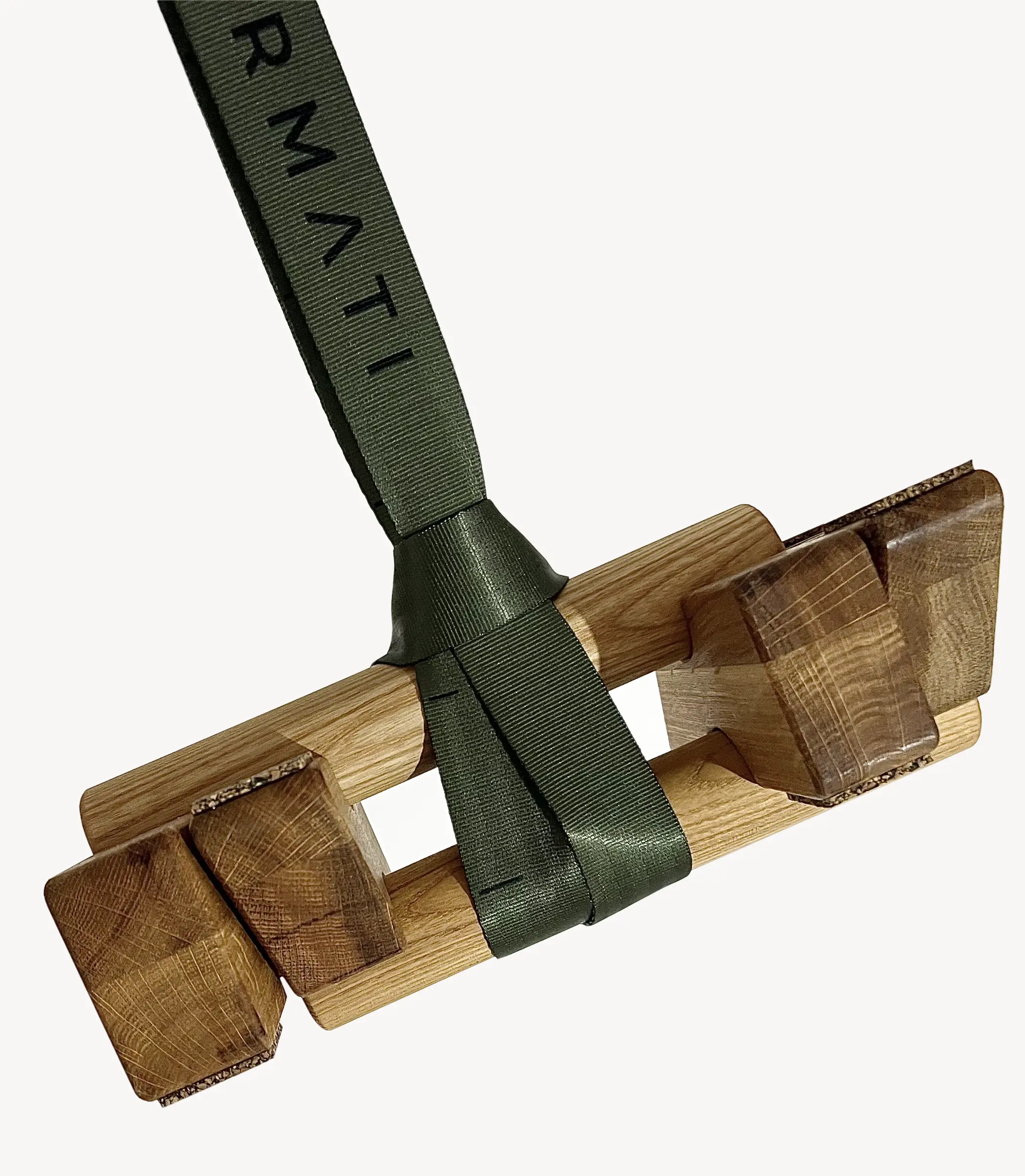 Wooden tool with a green strap labeled 'RMTI' on a white background