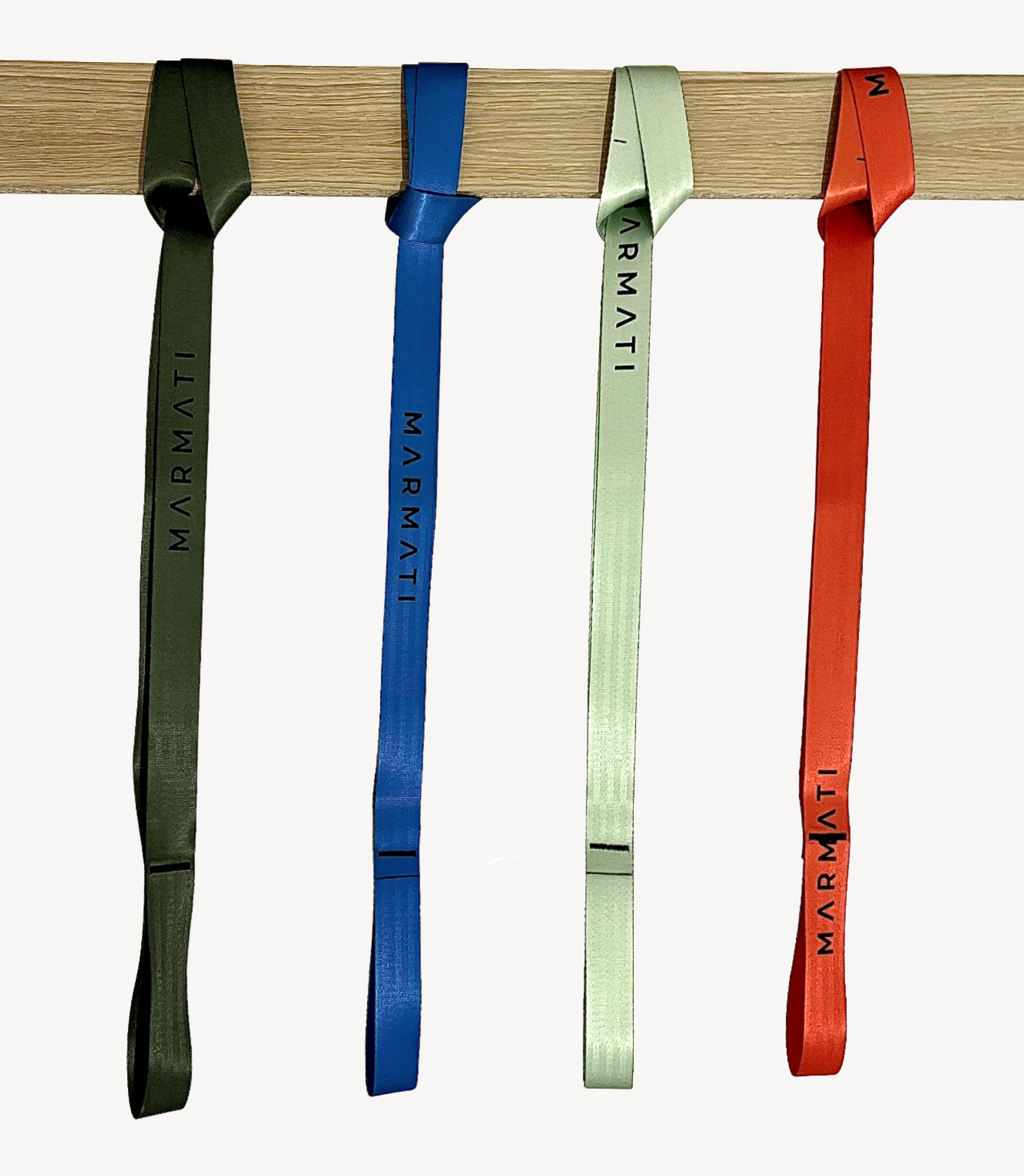 Four colorful straps with 'Marmati' branding hanging on a wooden bar.